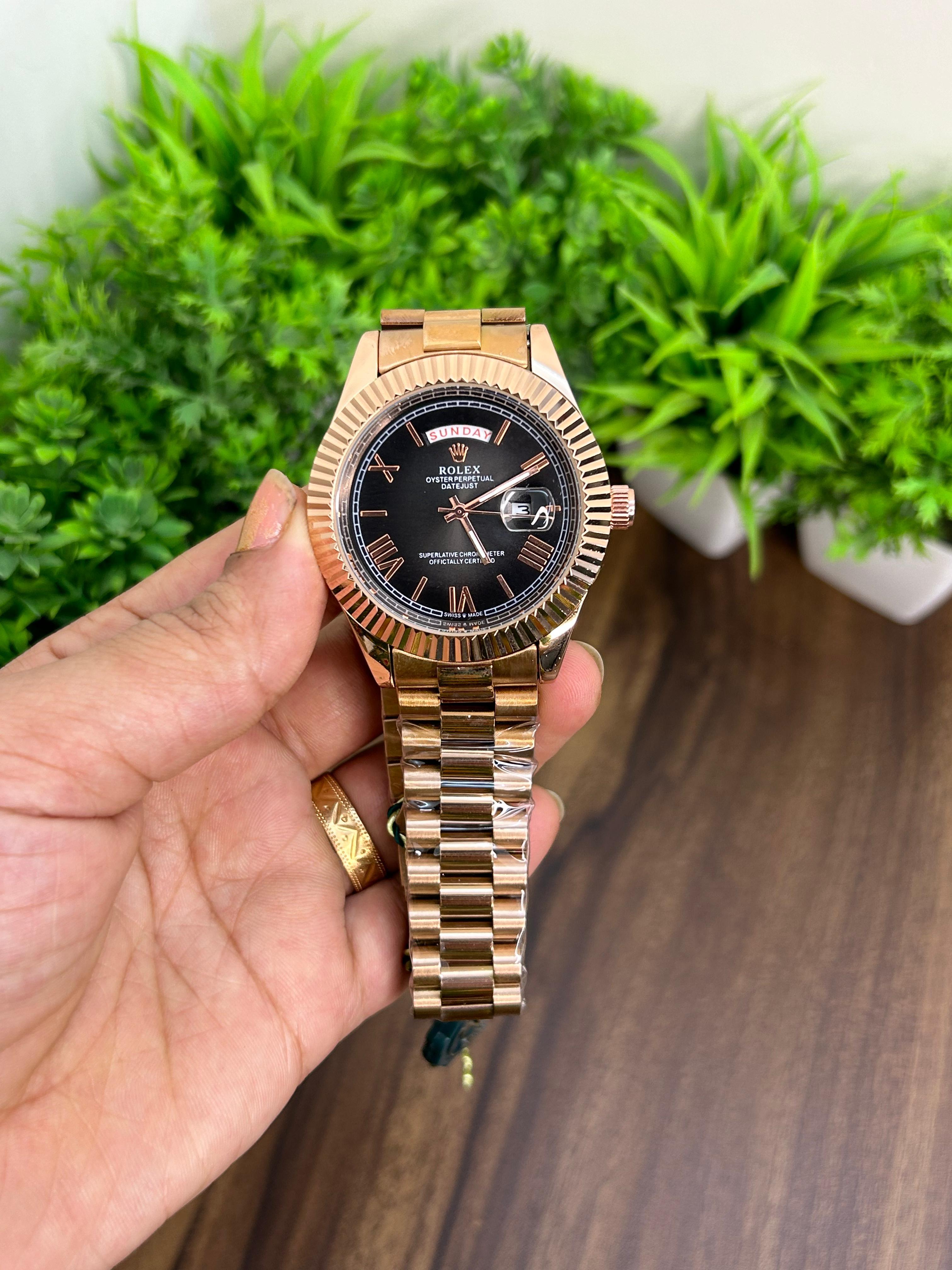 ROLEX DAY DATE, ROSE GOLD WITH BLACK DIAL 6545
