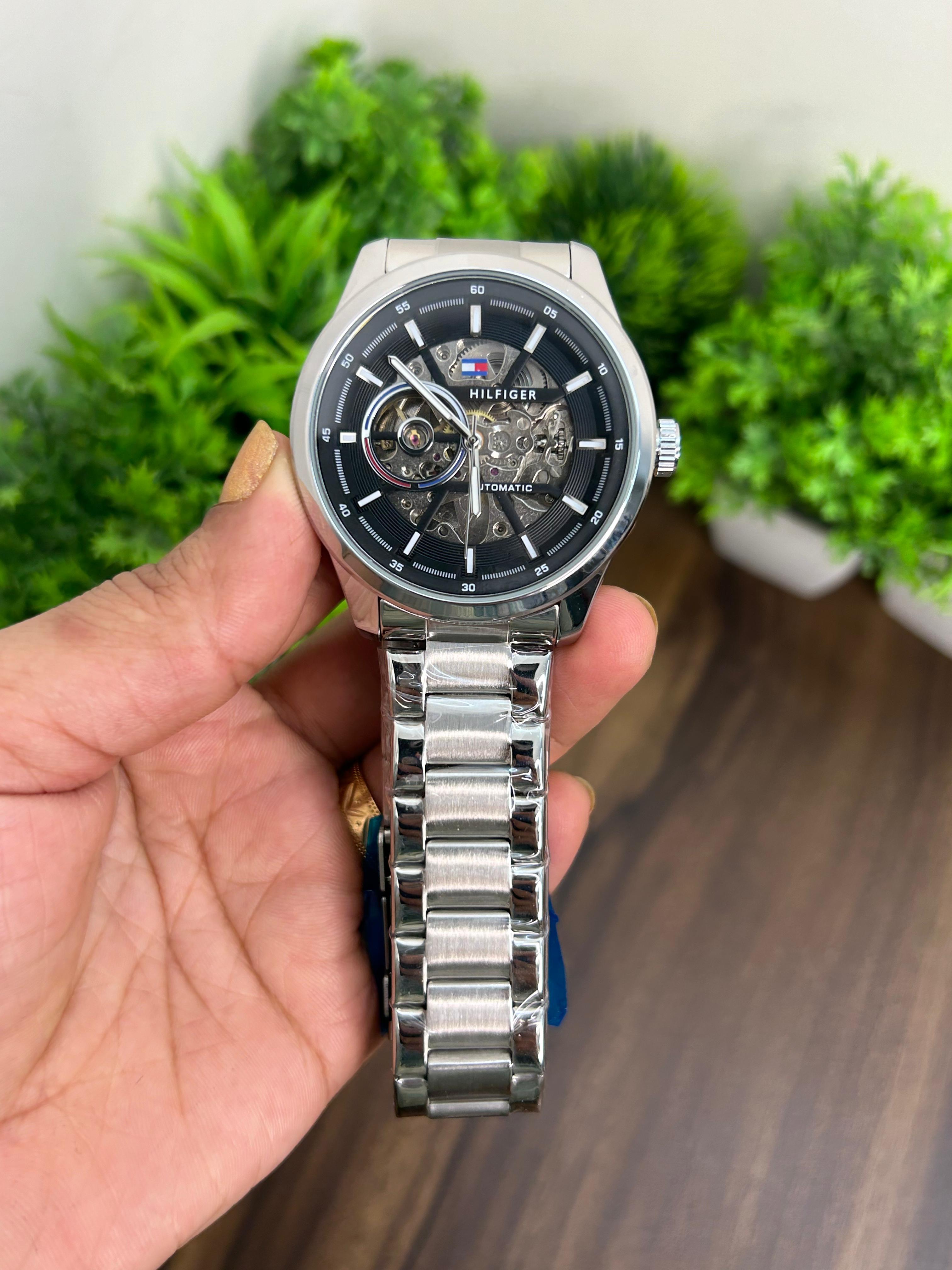 TOMMY HILFIGER AUTOMATIC SILVER BODY BLACK DIAL